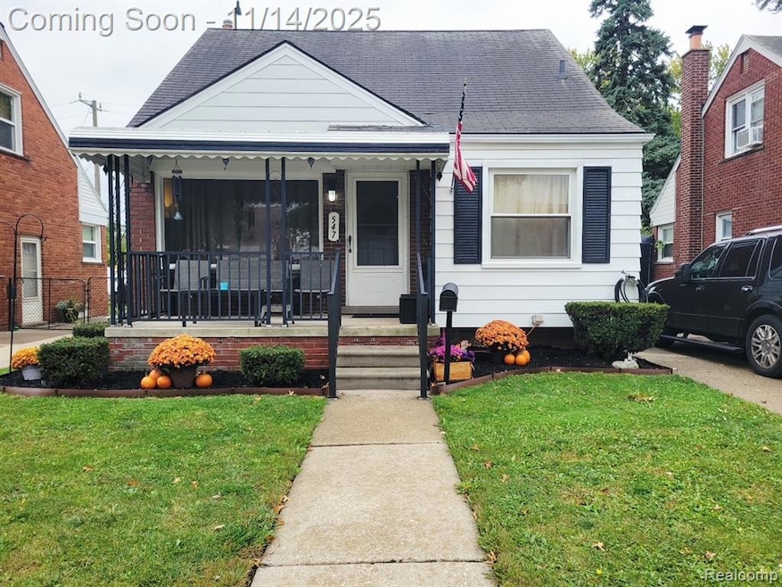 Bungalow-style house with covered porch, a front yard, and a shingled roof