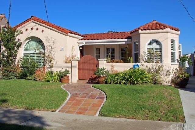 Major curb appeal ~ charming & stylish.