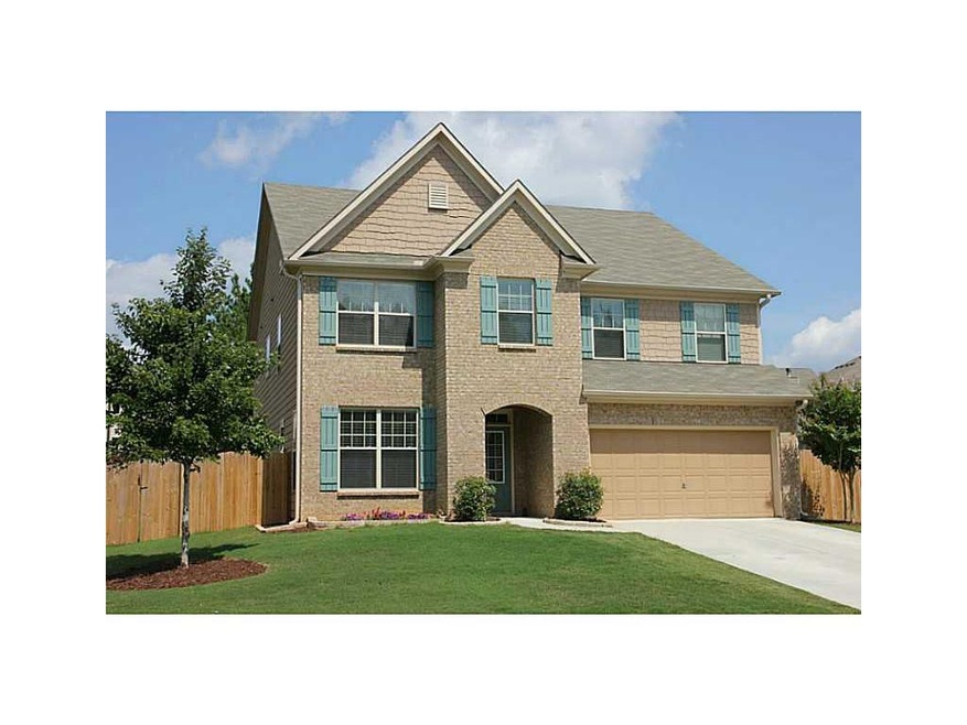 Exterior Front. Gorgeous traditional home with bri