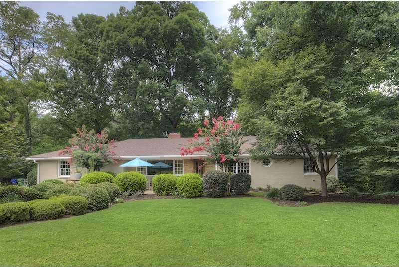 Exterior Front. Resting on a 3/4-acre corner lot i