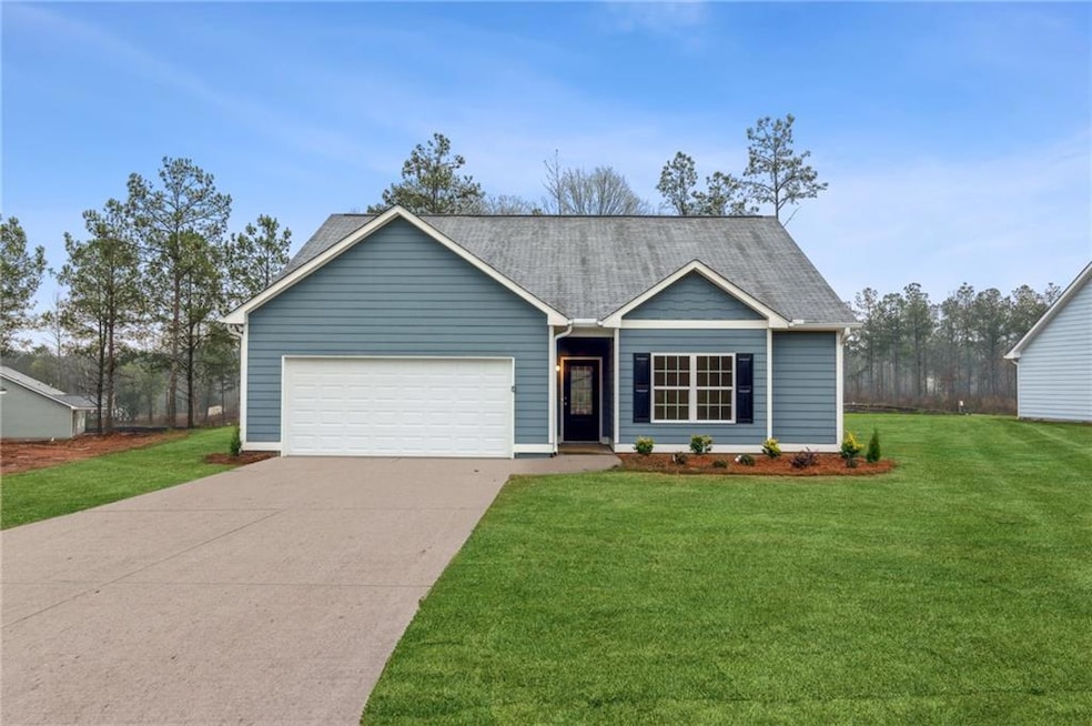 View of front of property featuring a front lawn a