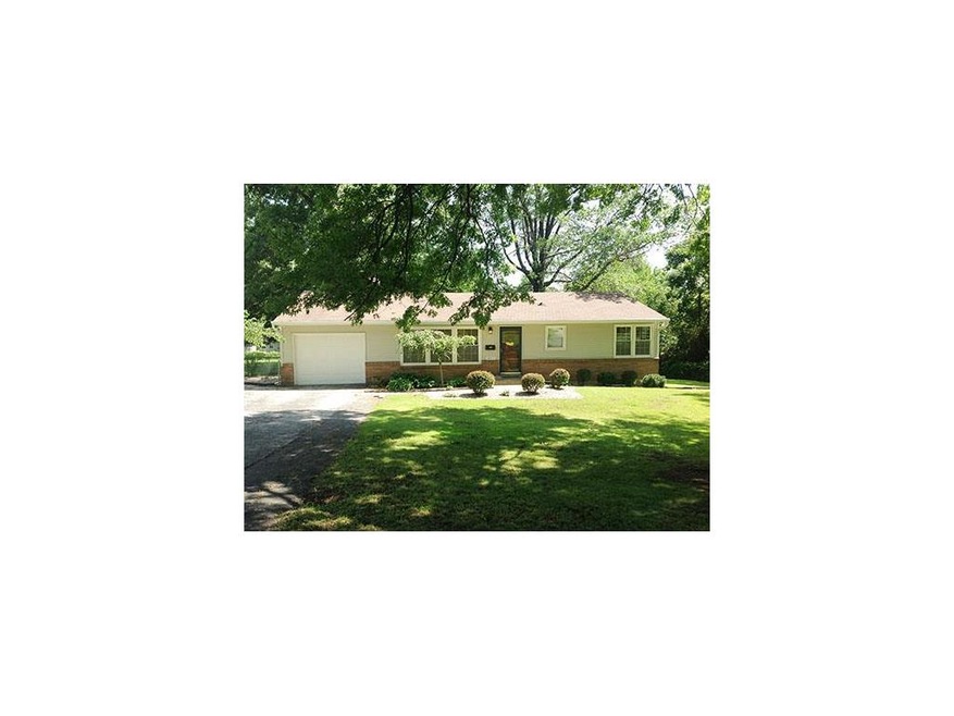 Vinyl siding and brick faade, gorgeous landscaping