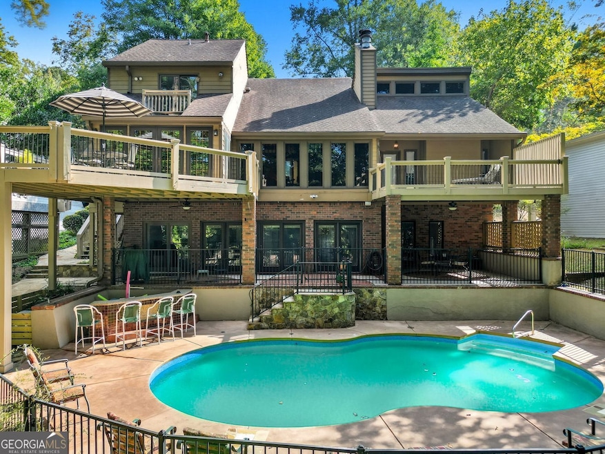 View of Lake Lanier and the swimming pool from almost every room.  30 x 30 two-story dock.