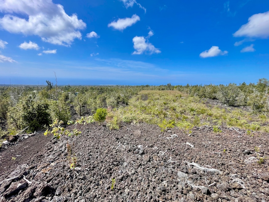 View of the back portion of the two acre property, from the elevated housepad. Ocean/sunset views from the housepad are unobstructed and very expansive.
