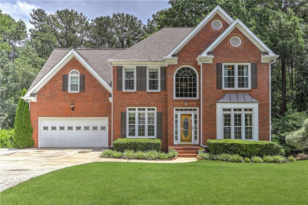 Lovely curb appeal. Extra parking pad to the left 