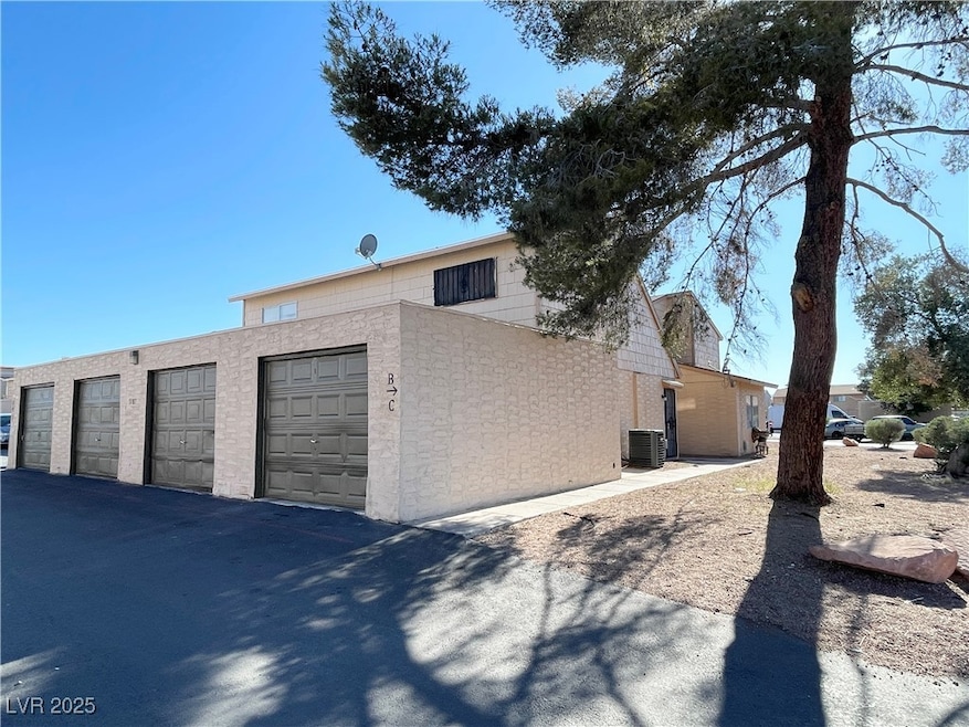 View of side of property with cooling unit