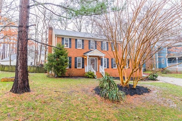 Large front yard with mature landscaping