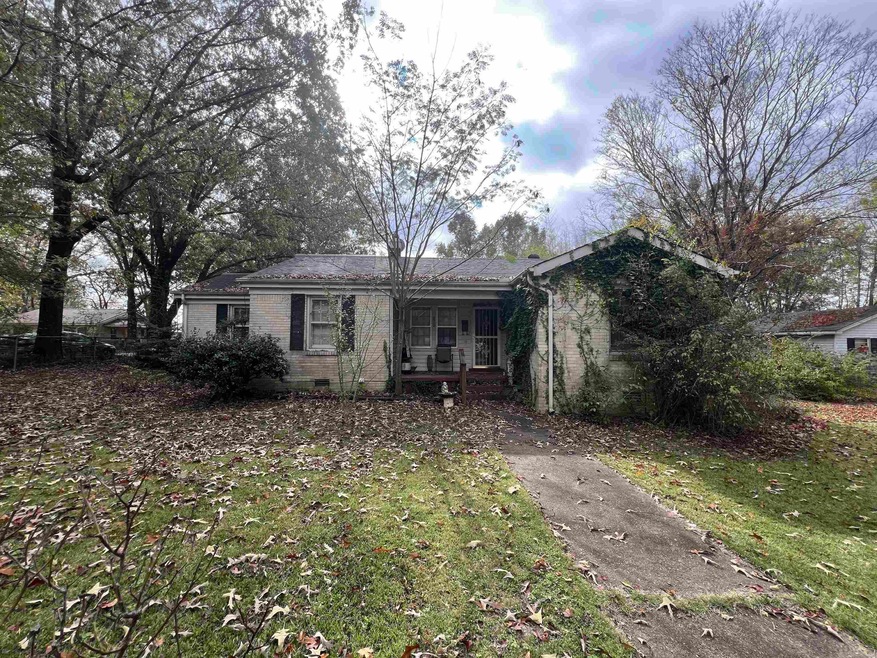Rear view of house featuring covered porch and a y