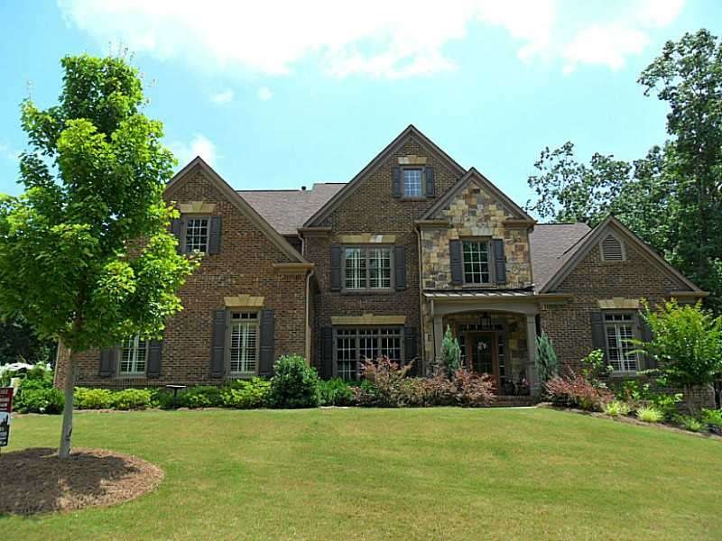 Exterior Front. Executive-style brick and stone en