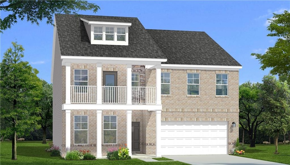 View of front of house with a garage, a front yard