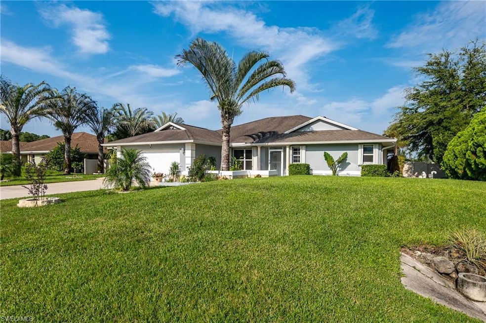 Single story home featuring a garage and a front l
