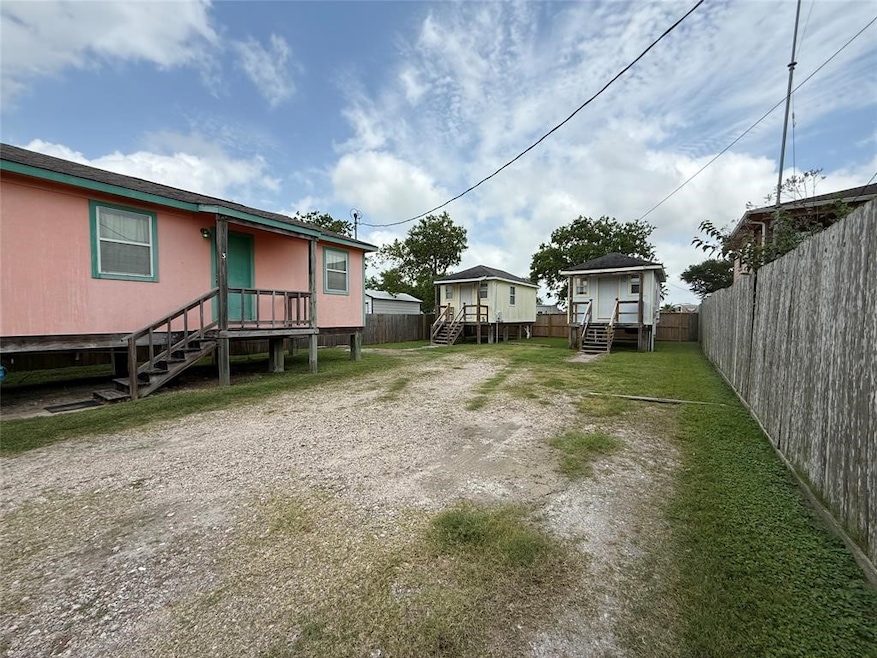 Fenced yard featuring stairs