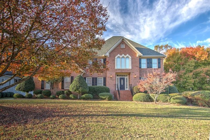 FOUR SIDES BRICK WITH 5 CAR GARAGE!  3 CAR ATTACHED AND TWO CAR 30 FEET DEEP DETACHED GARAGE WITH WALK UP STORAGE!  THIS HOME IS SURE TO PLEASE!!