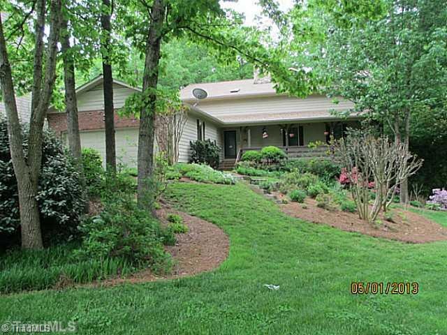 Exterior Front. Beautiful yard - much love has gone in to making this so lush!