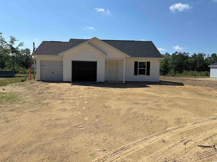 View of front of house featuring roof with shingle