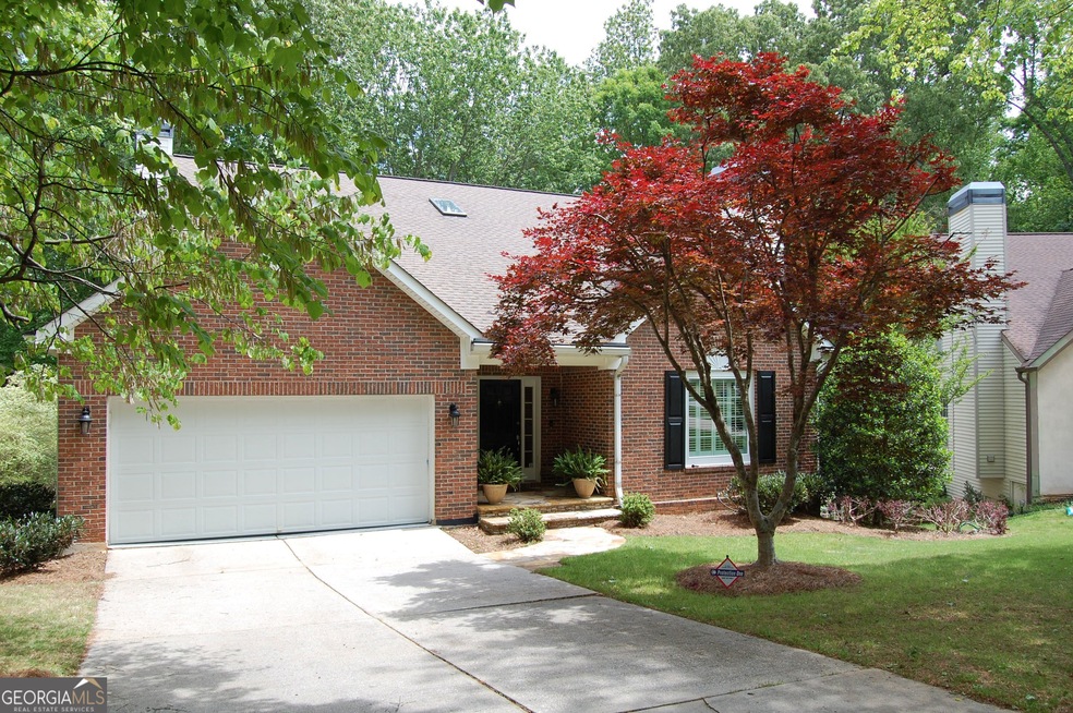 Front with driveway and garage