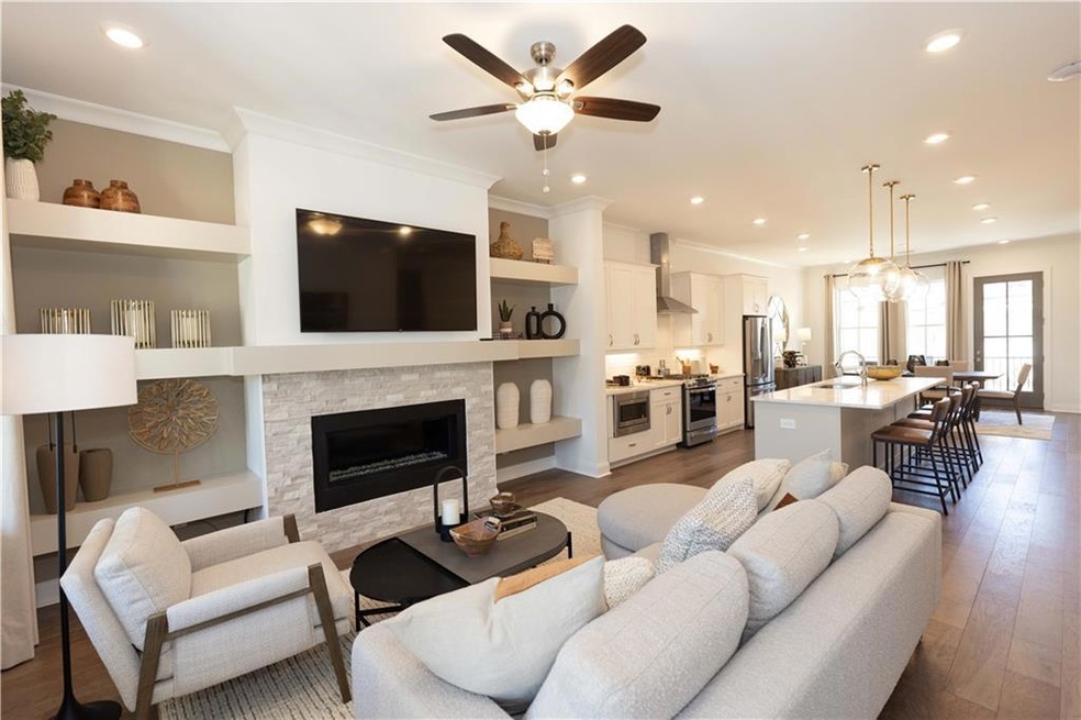 Living area with 10' ceilings and linear fireplace