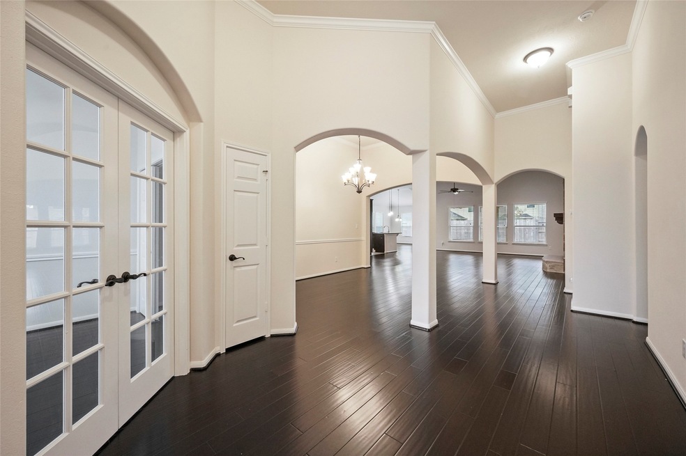 As you enter this home you are welcomed by beautifully architecturally designed arches.