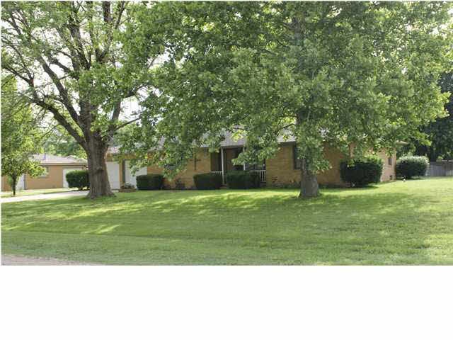 6900 Hollywood on .62 acre with mature trees and c