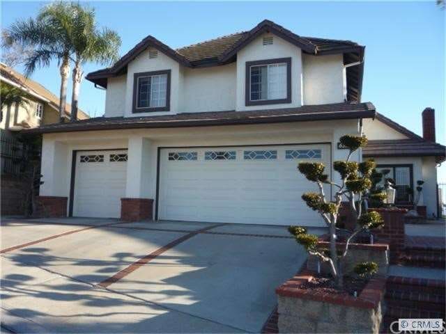Two Story with 3 car garage locate across from the