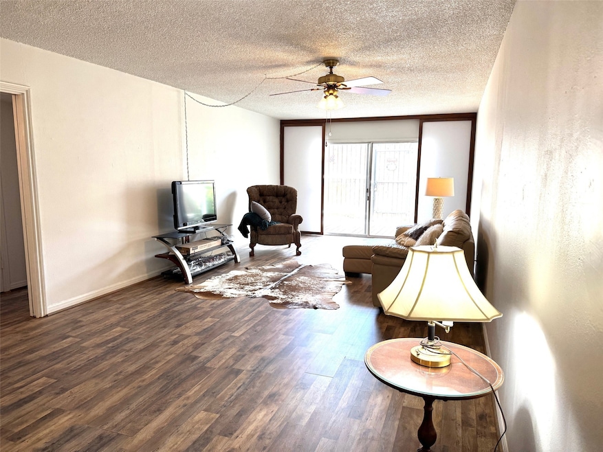 Living area-The new flooring goes throughout, exce