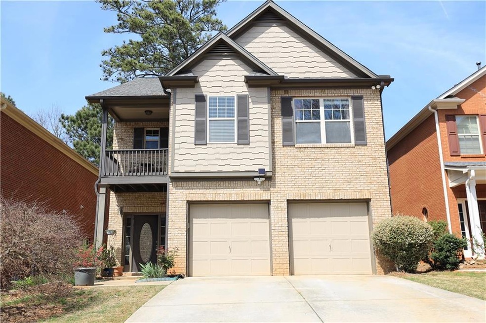 View of front of property featuring a balcony and 