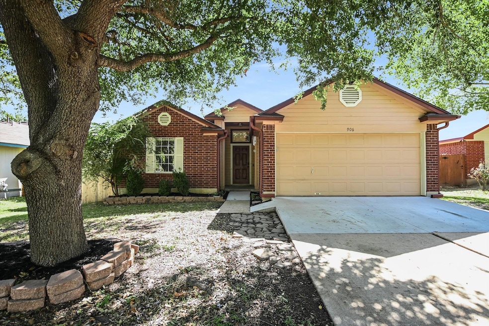 Ranch-style home with brick siding, driveway, and a garage