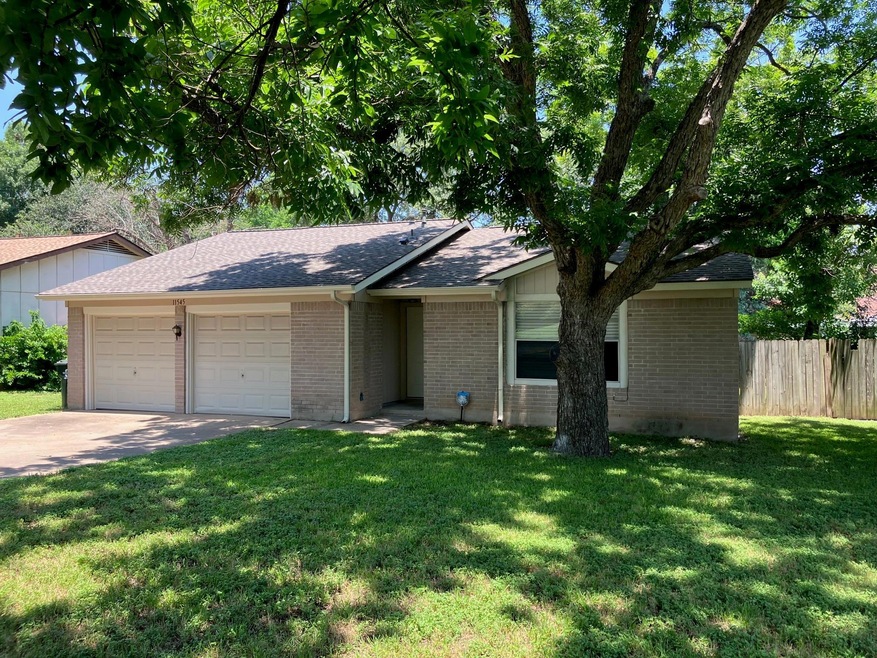 11545 Sandy Loam Trail. Two car garage has wall dividing sides.
