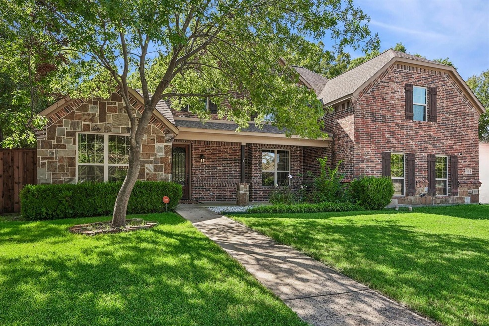 View of property with a front lawn