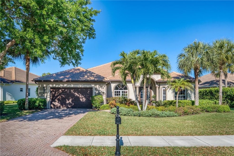 View of front of property with a front lawn, decor