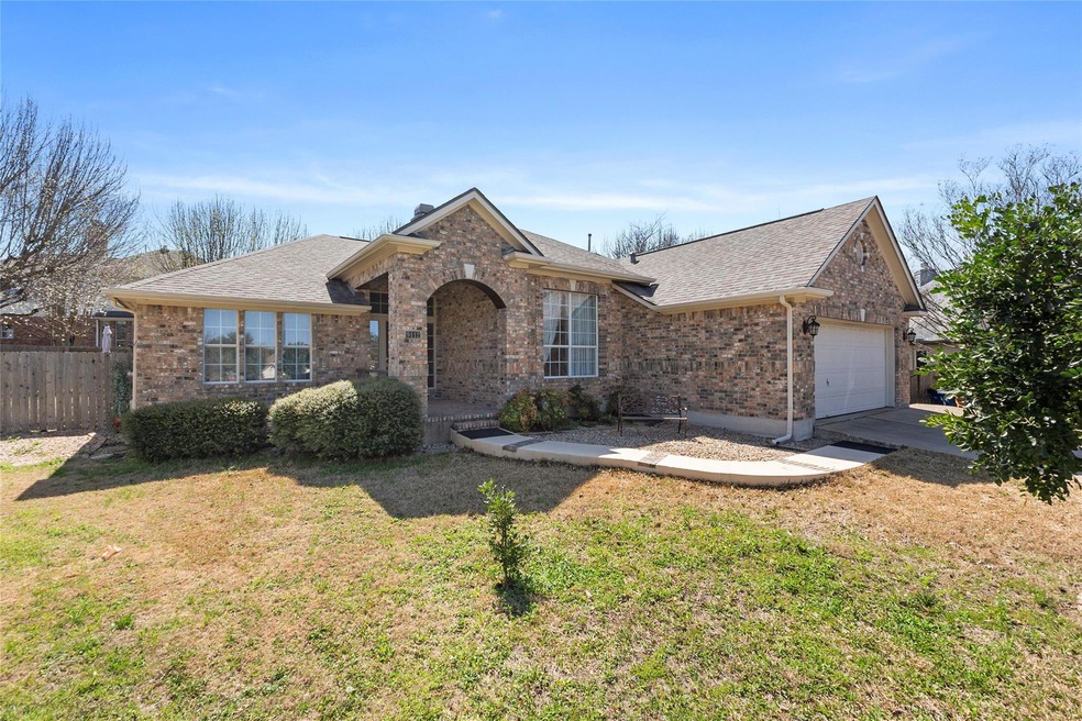 View of front of house with a front yard, fence, 