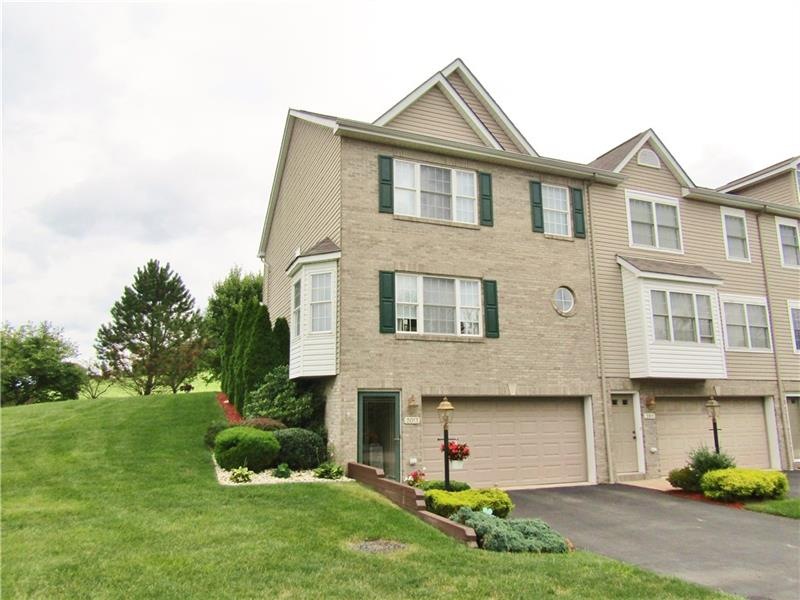THIS BRICK-FRONT, END UNIT IS LOCATED ON ONE OF TH