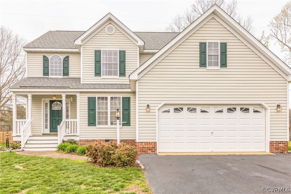 View of property with a porch, a front yard, and a