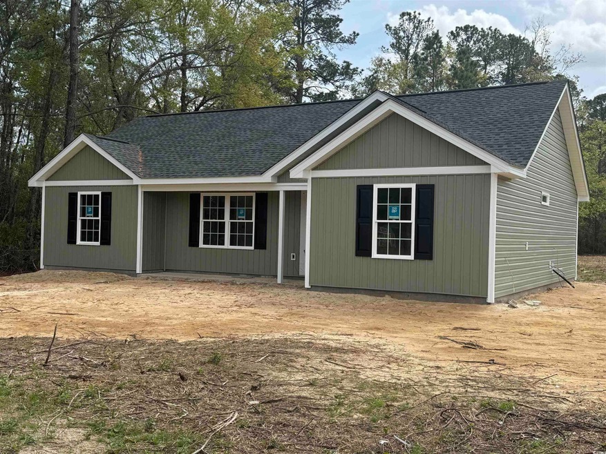 Ranch-style house with a shingled roof