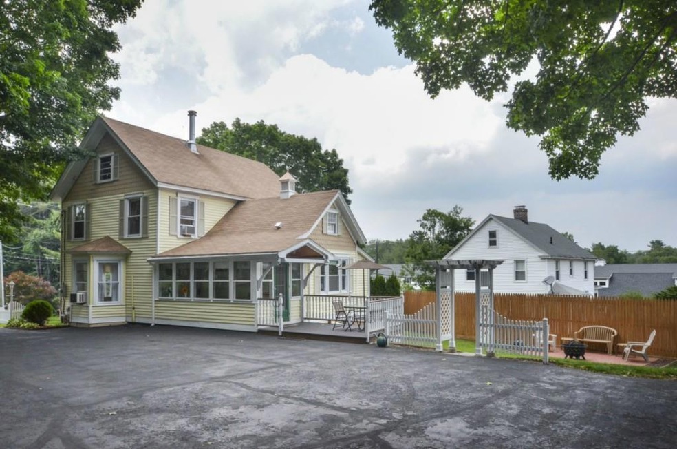 An oversized paved parking area leads to the deck 