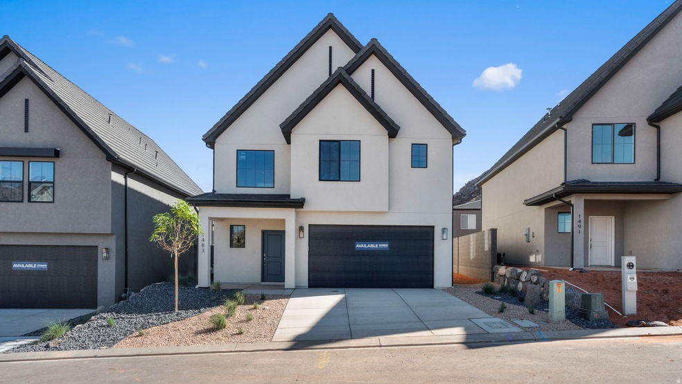 Modern farmhouse featuring stucco siding, concrete driveway, and a garage