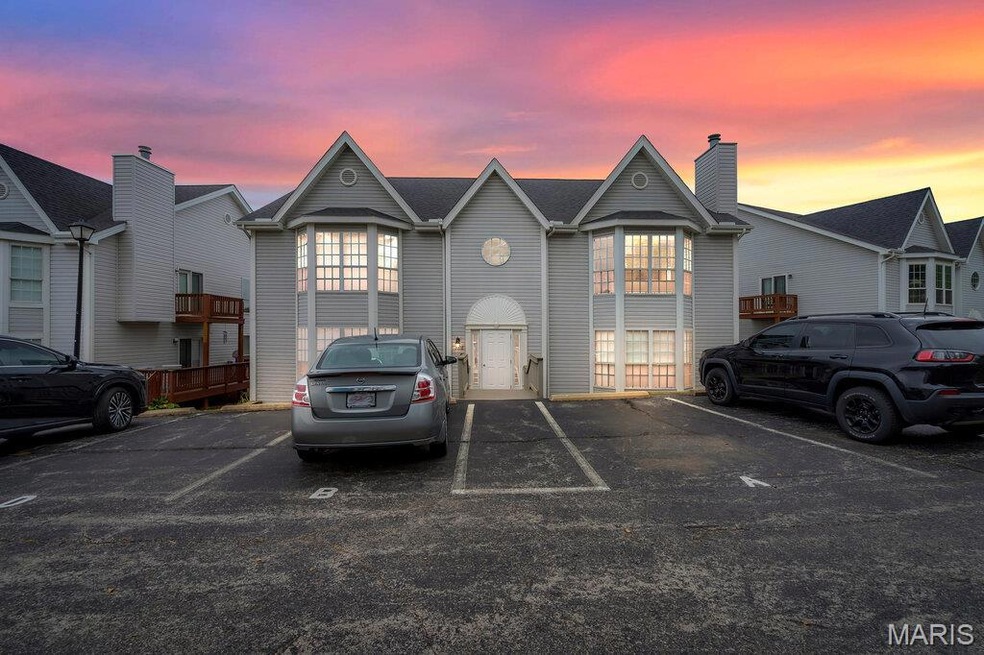 Traditional-style home with uncovered parking