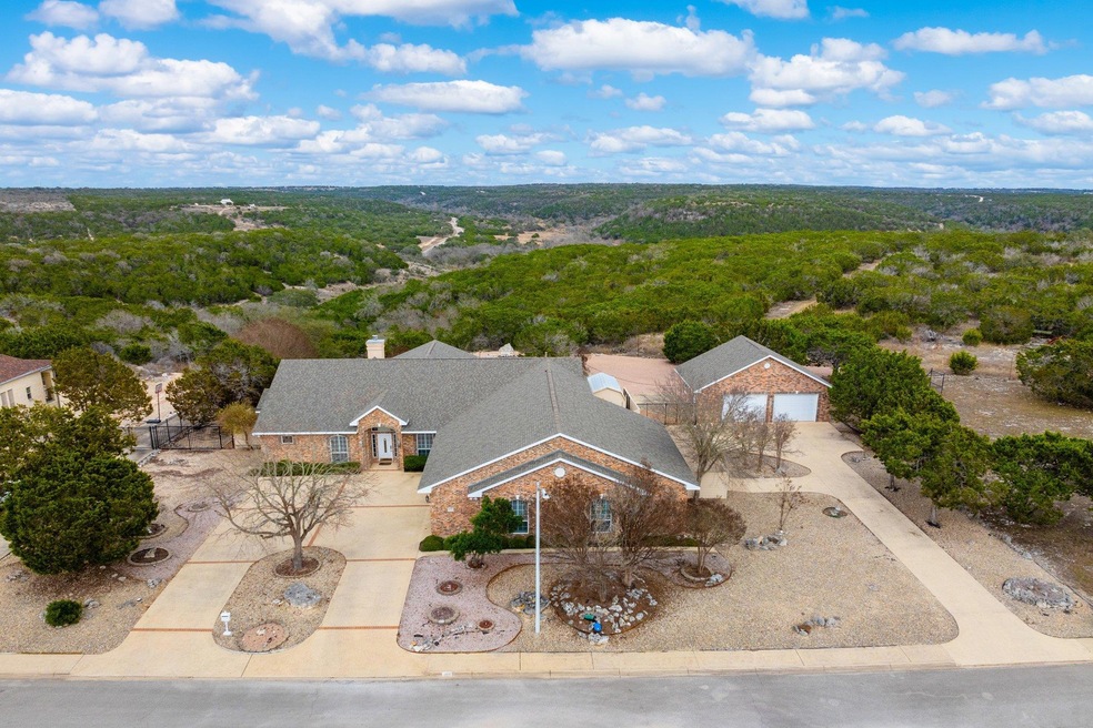 View from above of property featuring a heavily w