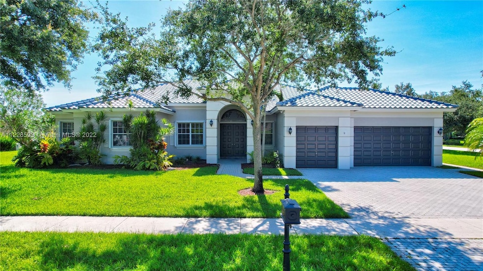 This lovely home is situated on an exceptional over-sized acre corner lot with water views from every room.  Located inside Imagination Farms!  An exclusive 24 hour guard gated community.