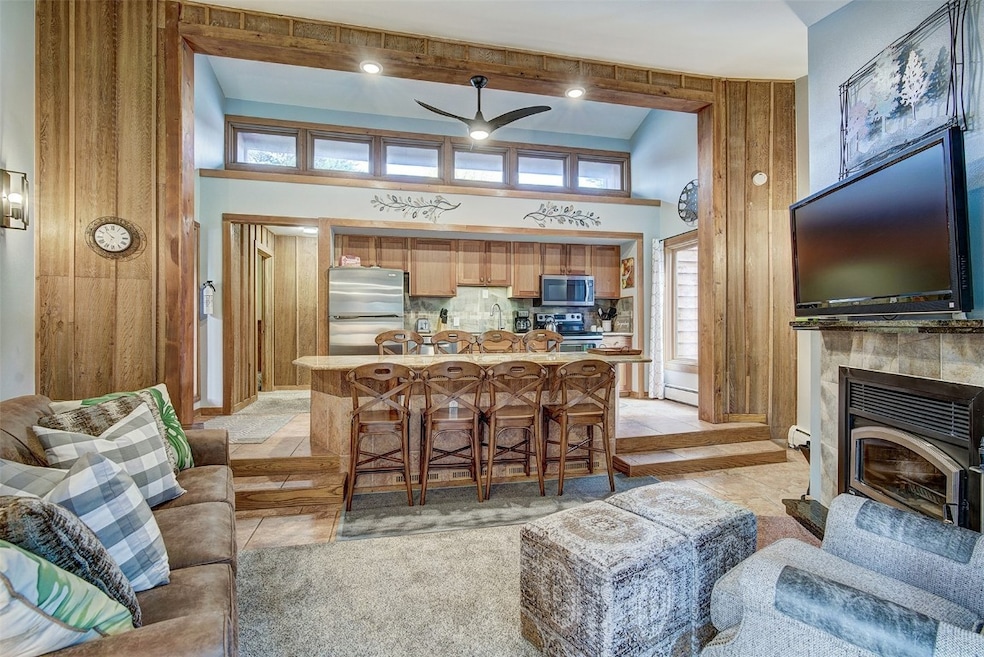 Living room featuring ceiling fan