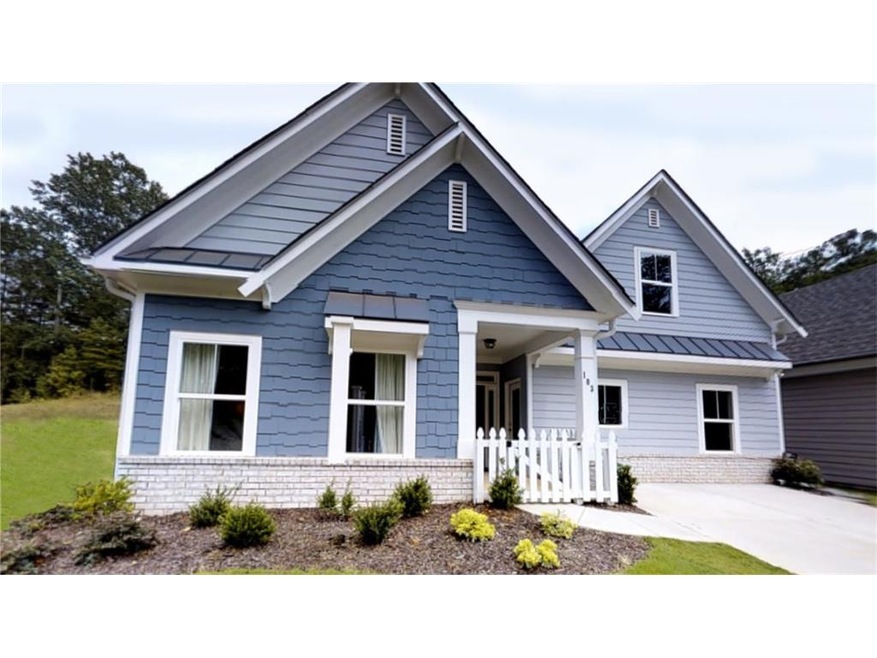 Elevation with siding, shake and brick.