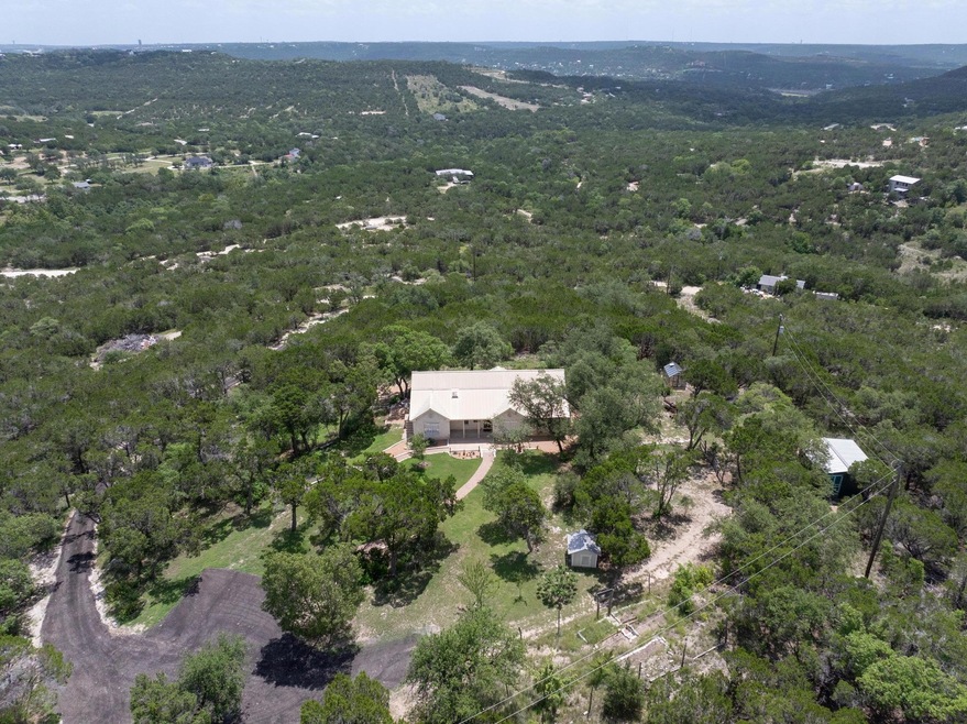 Aerial view of property and surrounding area with
