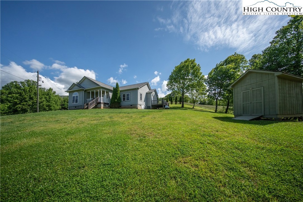 Darling Cottage with covered porch entry on .91 ro