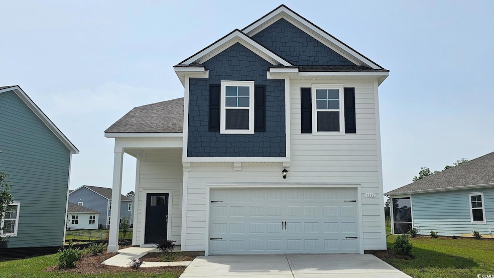 View of front facade featuring an attached garage and concrete driveway