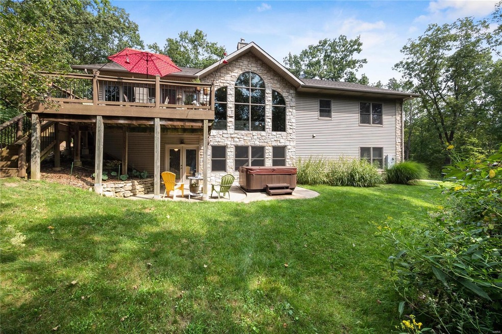 Great wall of windows overlook the backyard