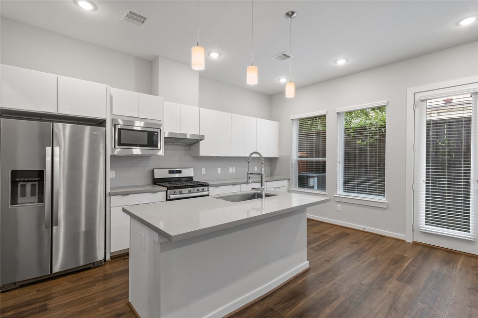 Open concept kitchen/living room space.