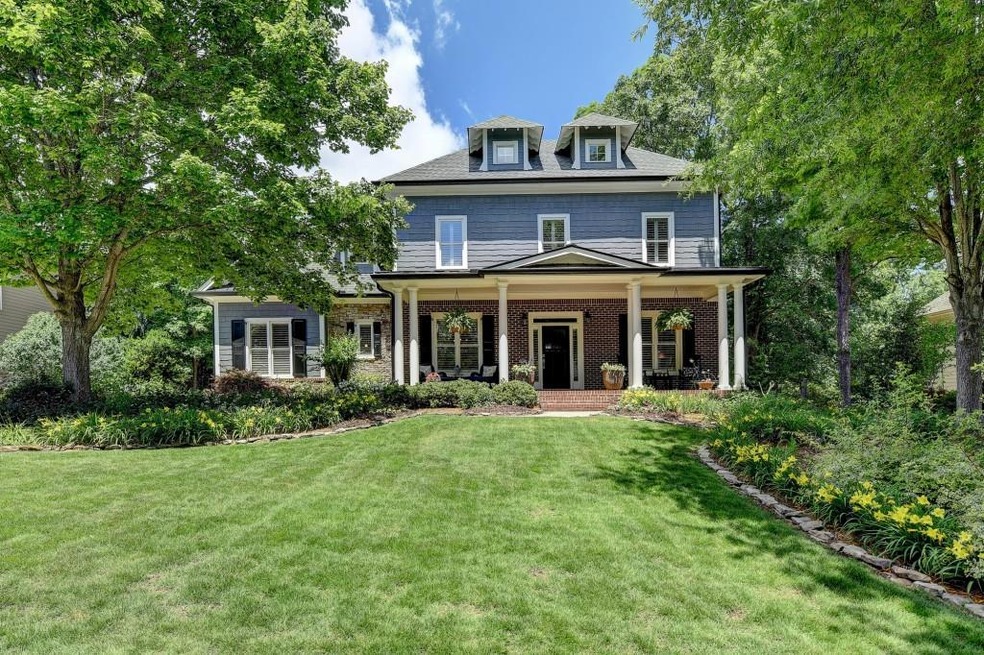 Welcome home to this stunning craftsman style home in sought after Three Chimneys Farm!