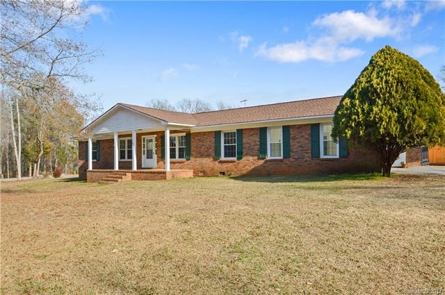 Stately brick ranch with classic front porch!