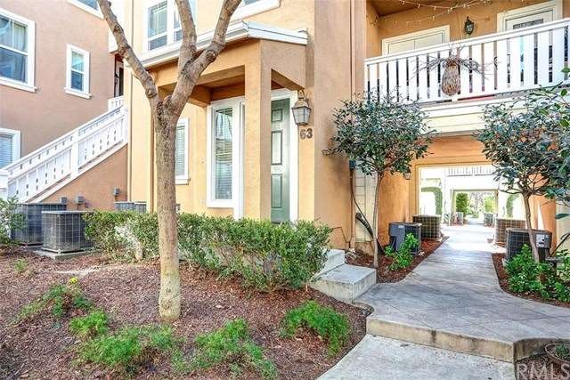 Welcome to 63 Valmont Way! The front door is locat