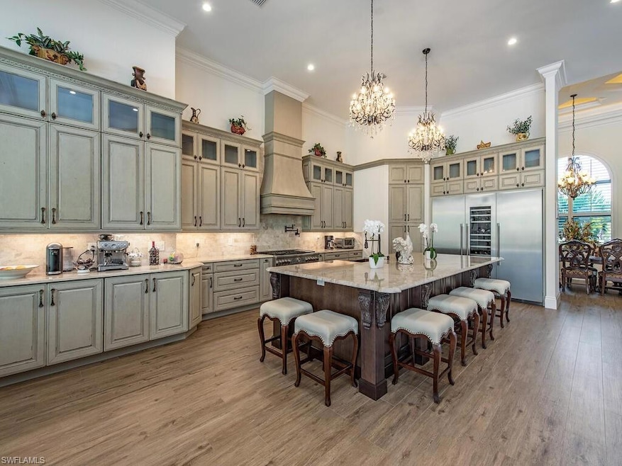 Kitchen featuring light stone countertops, a notab